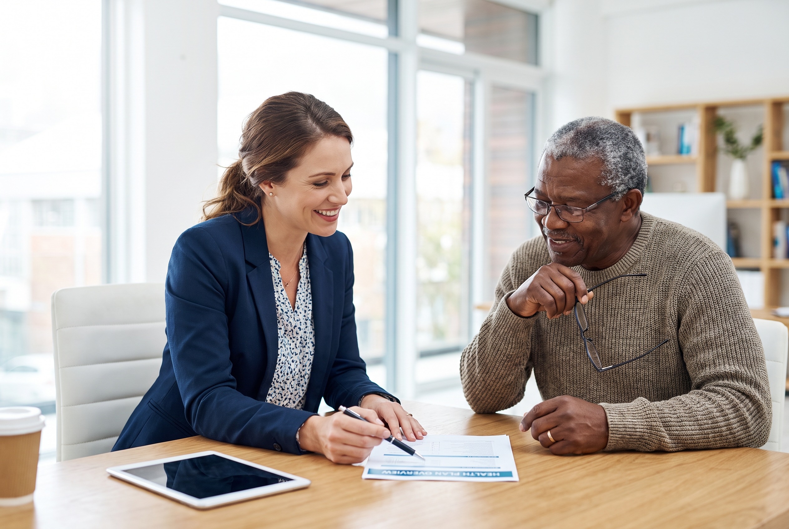 A healthcare consultant reviewing plan options with a client